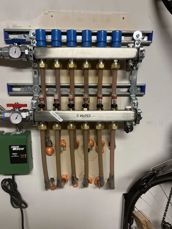 Plumber performing Water Heater Repair at a residential property in Corrales